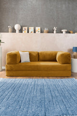 Senffarbene Poufudic-Sofa