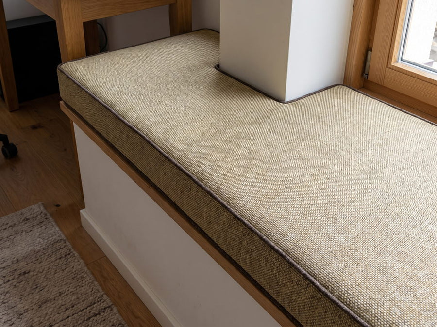 A window seat cushion with a cut-out around a column