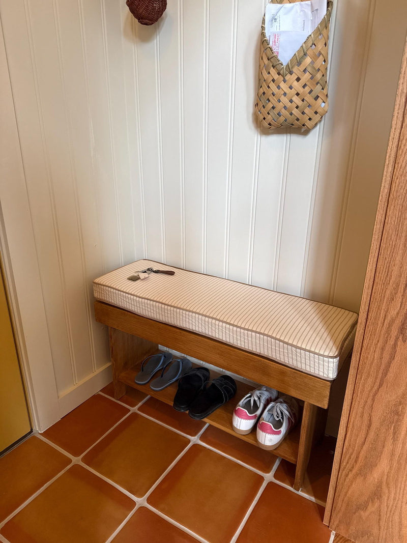 Customer photo: striped cushion on a small wooden entryway bench