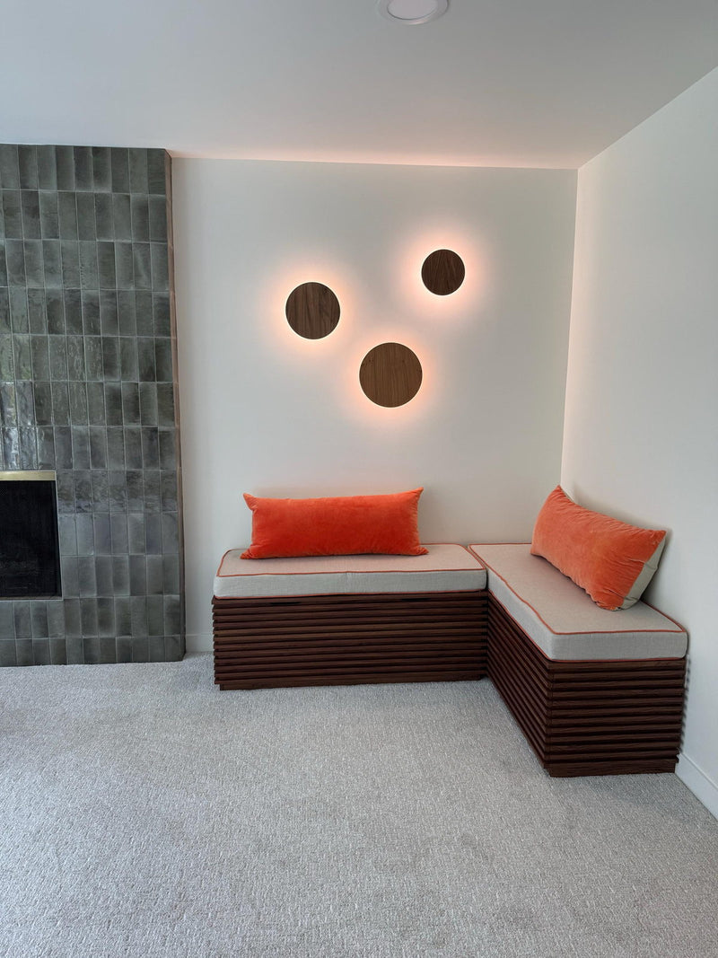 Customer photo: cream L-shaped bench cushions with orange pillows in a modern room