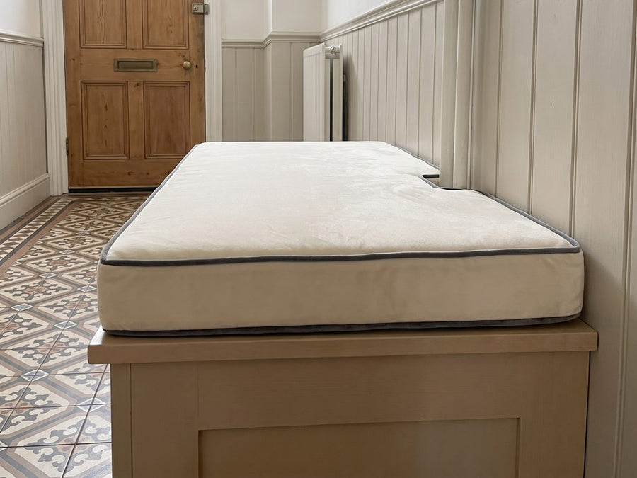 A bench cushion with a notch cut into one edge